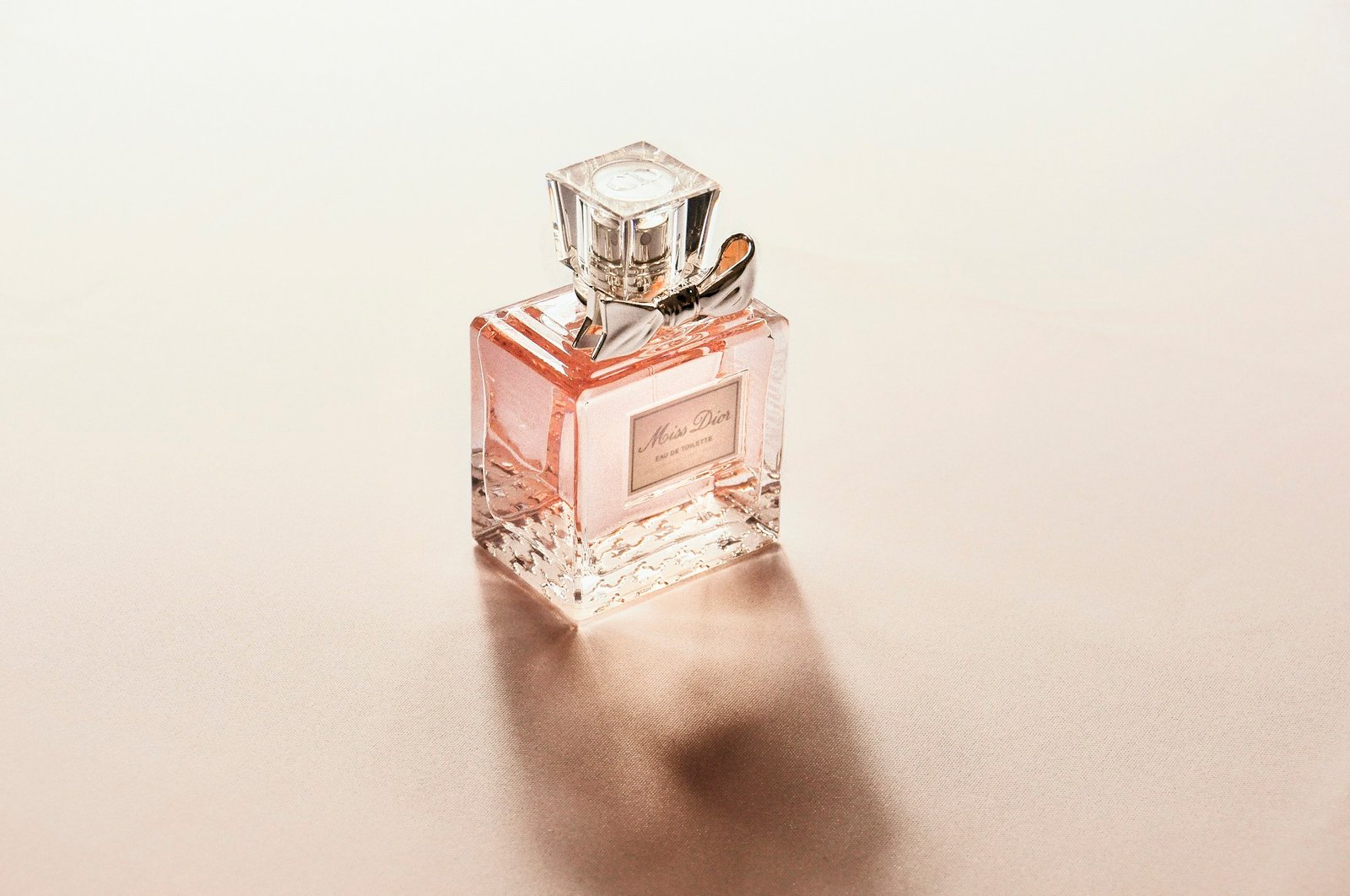 Fragrance bottle on a sunlit surface